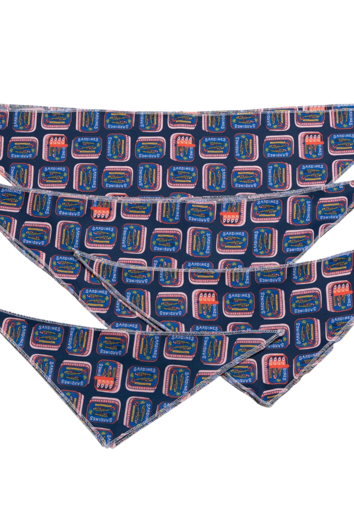 Three folded bandanas with a geometric pattern on a white background