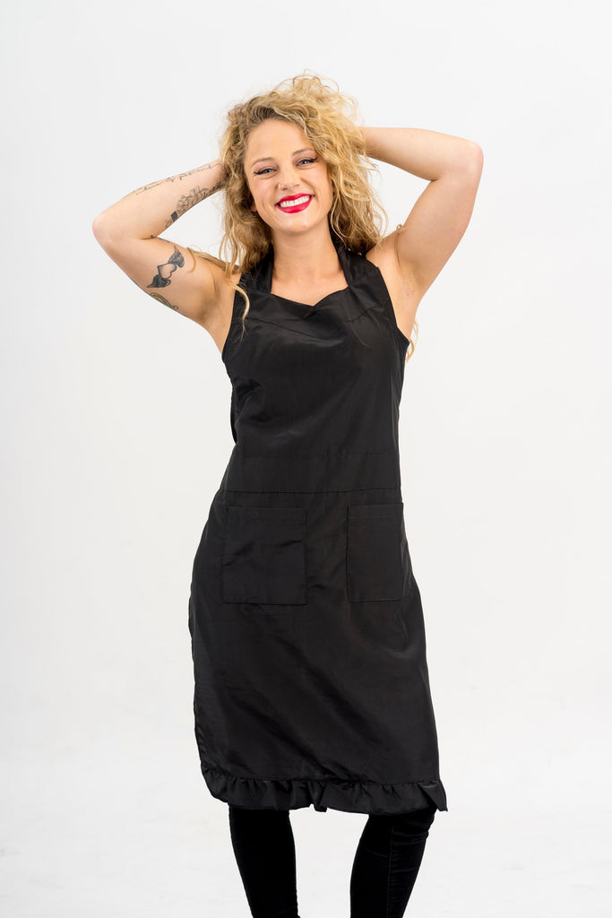Pet groomer posing wearing a Black Grooming Apron